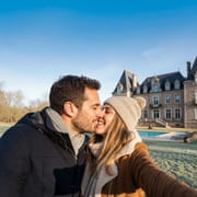 couple in front of a castle